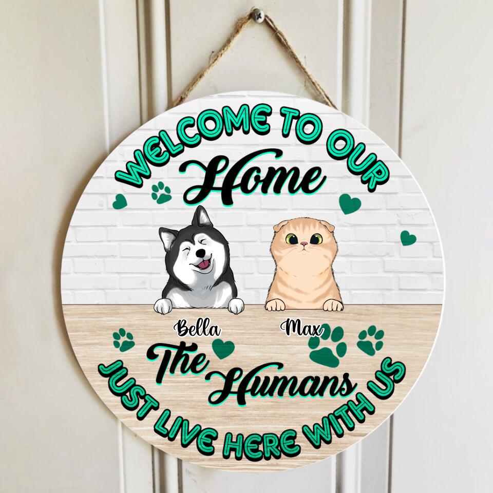 Welcome To Our Home, The Humans Just Live Here With Us - Personalized  Wooden Door Sign