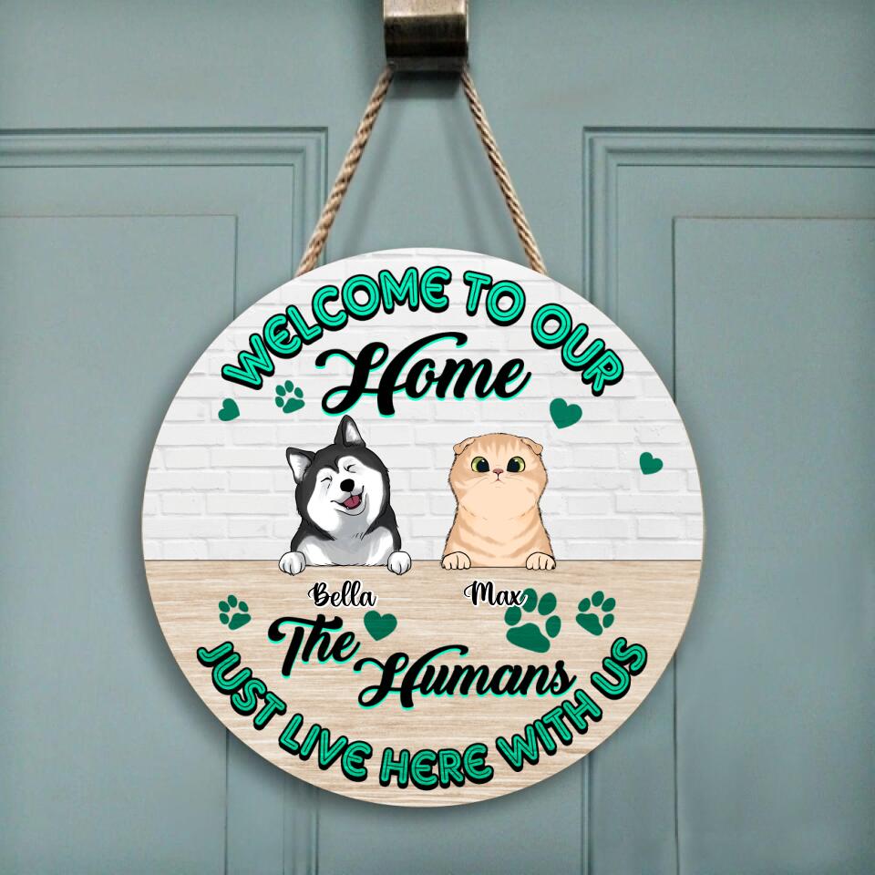 Welcome To Our Home, The Humans Just Live Here With Us - Personalized  Wooden Door Sign