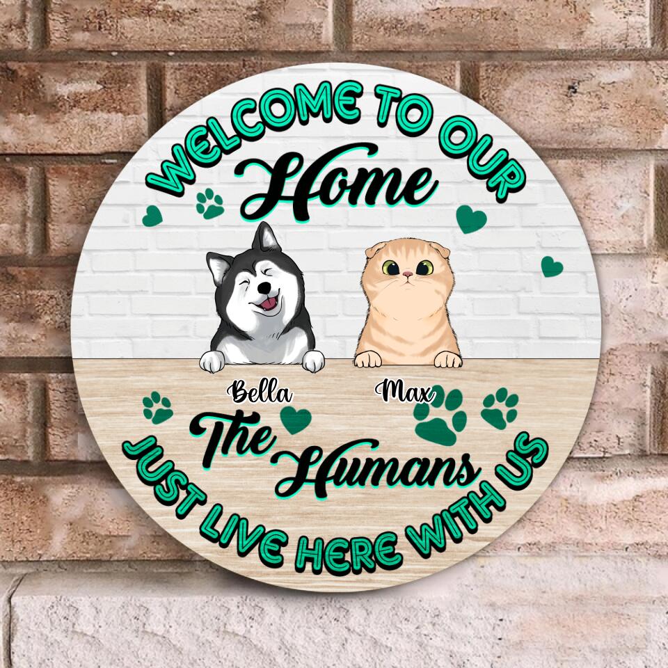 Welcome To Our Home, The Humans Just Live Here With Us - Personalized  Wooden Door Sign