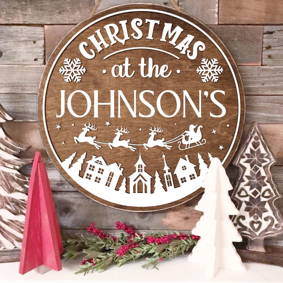 Christmas At The Family - Personalized Wooden Door Sign, Christmas Gift For Family