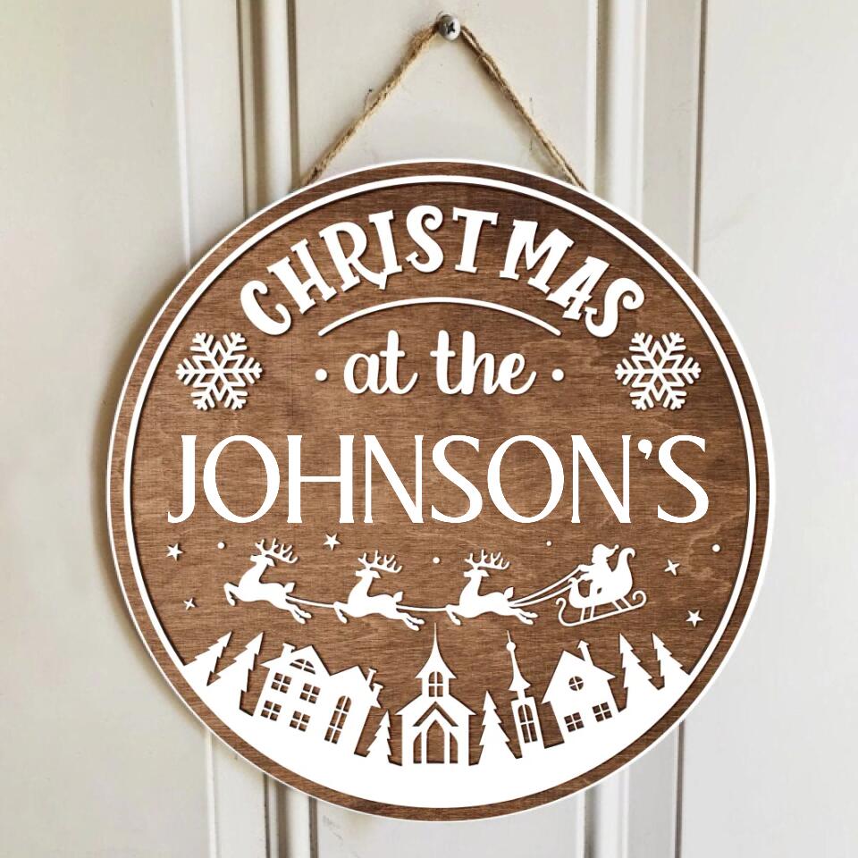 Christmas At The Family - Personalized Wooden Door Sign, Christmas Gift For Family