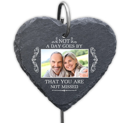 Heart-shaped slate plaque with a photo of a couple and text 'Not a day goes by that you are not missed'.