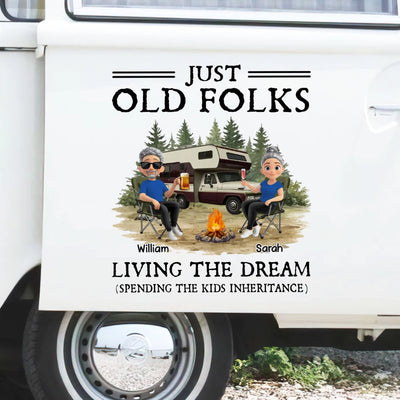 Decal door with 'Just Old Folks Living the Dream' design featuring two people by a campfire and RV.