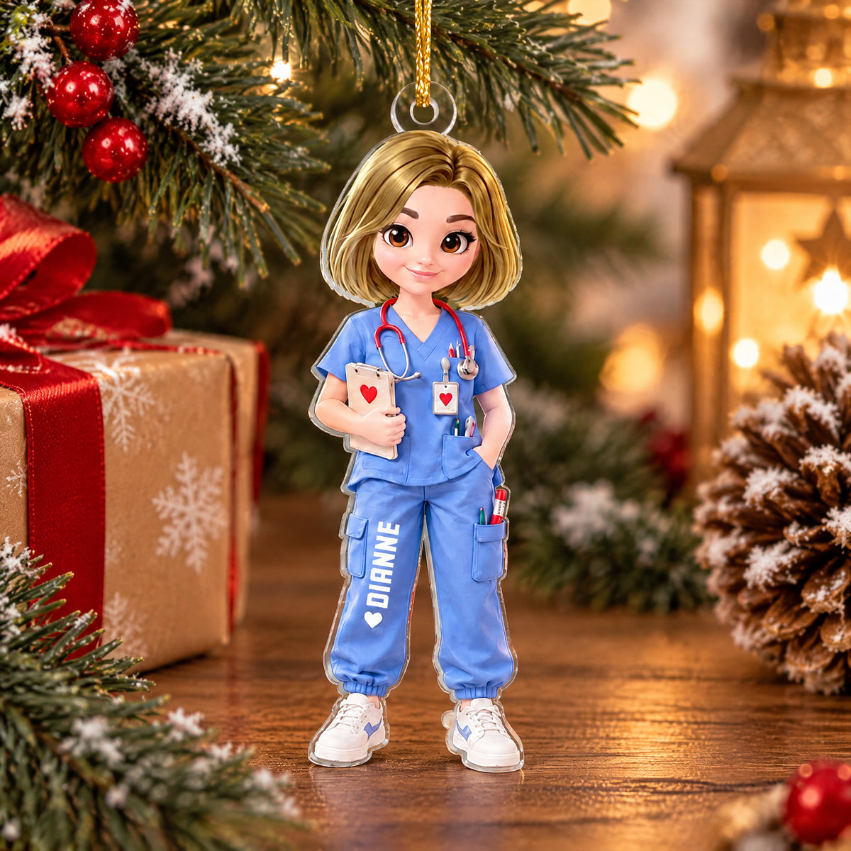 Personalized nurse acrylic ornament standing on a wooden table beside a wrapped gift and a pinecone