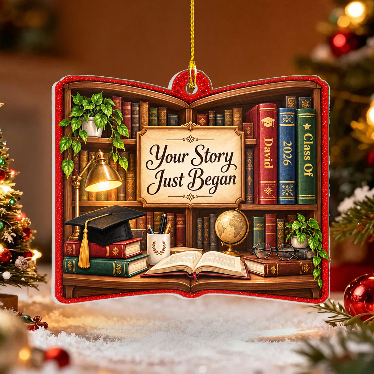 Personalized acrylic library shelf ornament on snowy surface beside a lit Christmas tree and red baubles