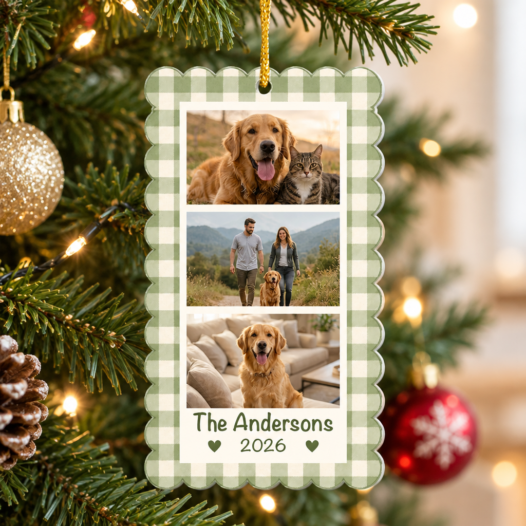 Personalized acrylic photo collage ornament hanging on a lit Christmas tree with a gold ornament and pinecone nearby