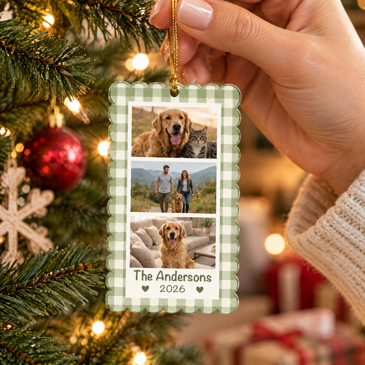 Personalized acrylic photo collage ornament held by a hand in a cream sweater, with tree lights and gifts behind