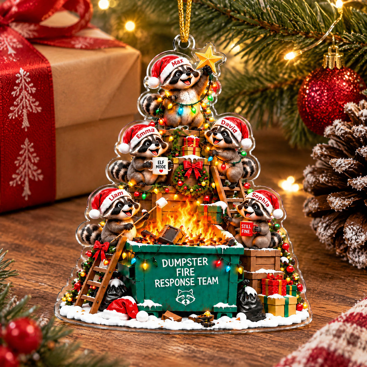 Personalized Acrylic Christmas Ornament standing on a wood surface beside a wrapped gift and a pinecone