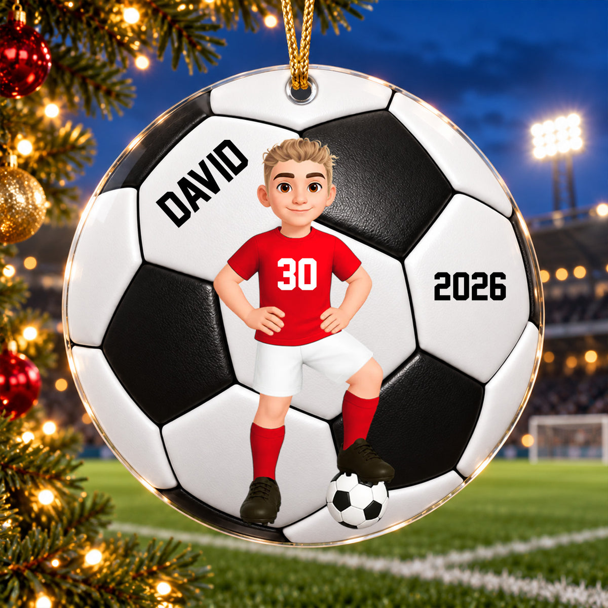 Personalized soccer acrylic ornament with red-shirt player, name and year, by tree lights and a stadium field at night