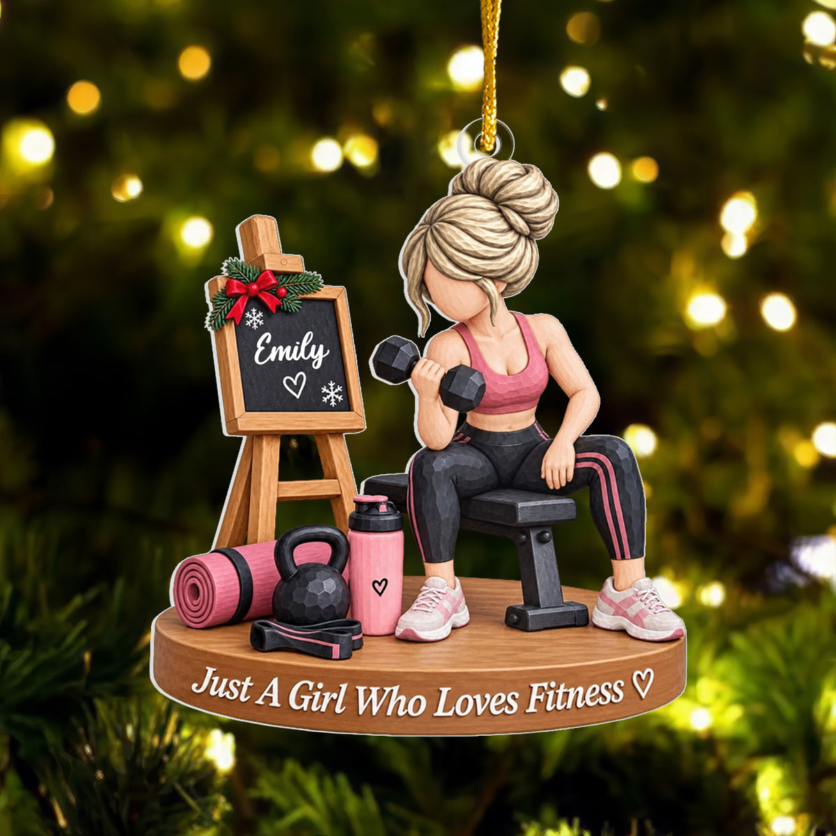 Personalized fitness girl acrylic ornament with blonde hair bun and Emily chalkboard in front of a lit tree