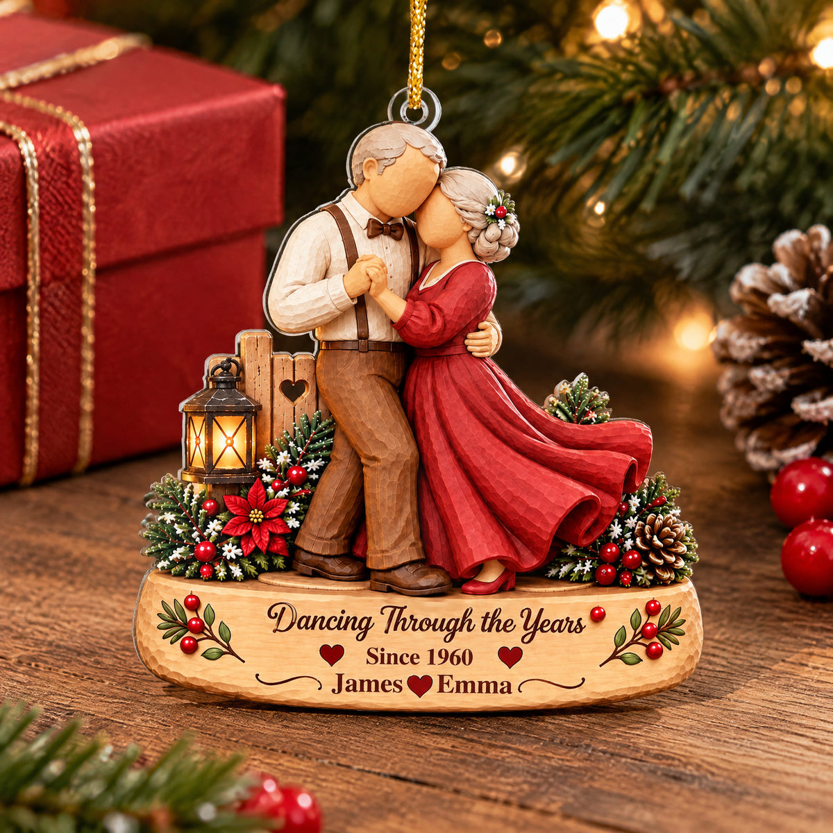 Personalized Acrylic Ornament Dancing Couple standing on a wooden table beside a red gift box and pinecone
