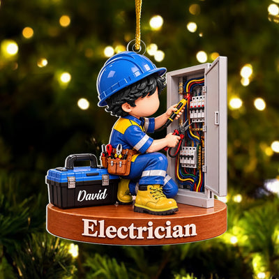 Personalized acrylic electrician Christmas ornament with black-haired figure and David toolbox, hanging before tree lights