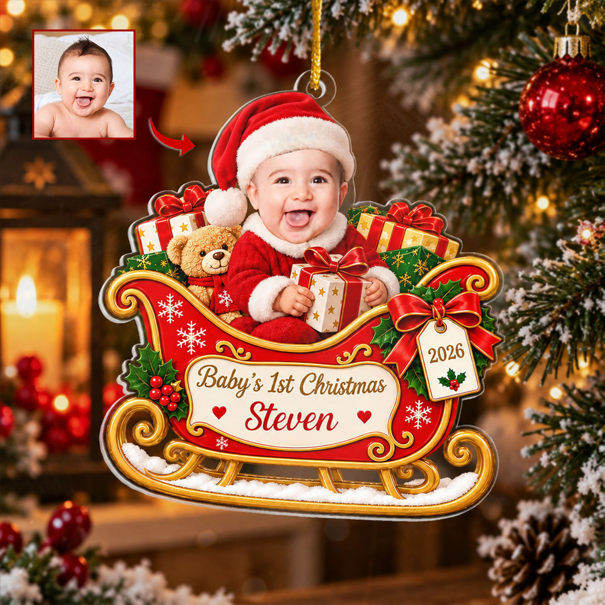Personalized Custom Baby Face Acrylic Ornament hanging on a Christmas tree beside a red bauble, with a small baby photo inset