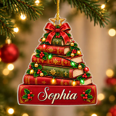 Personalized book Christmas tree acrylic ornament hanging on a pine branch with the name Sophia on the red book