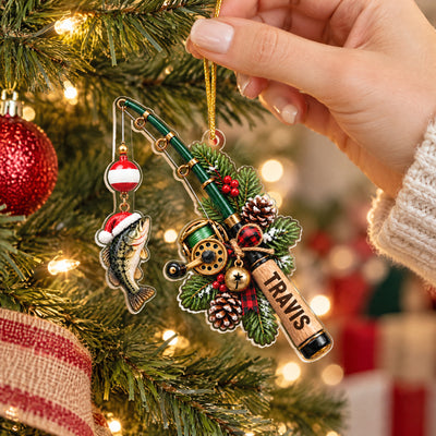 Personalized Acrylic Fishing Ornament held by a hand in a knit sleeve beside a red bauble on a tree