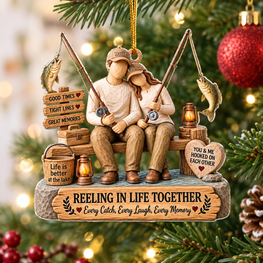 Personalized Acrylic Ornament Reeling In Life Together on a lit Christmas tree with a pinecone nearby