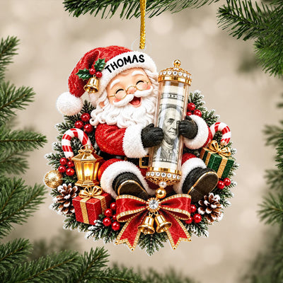 Personalized Acrylic Ornament Money Holder with Santa hugging a cash tube, hanging on a pine branch