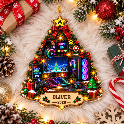 Personalized Gamer Christmas Tree Acrylic Ornament lying on white fur with wrapped gifts, candy cane and pinecones around it