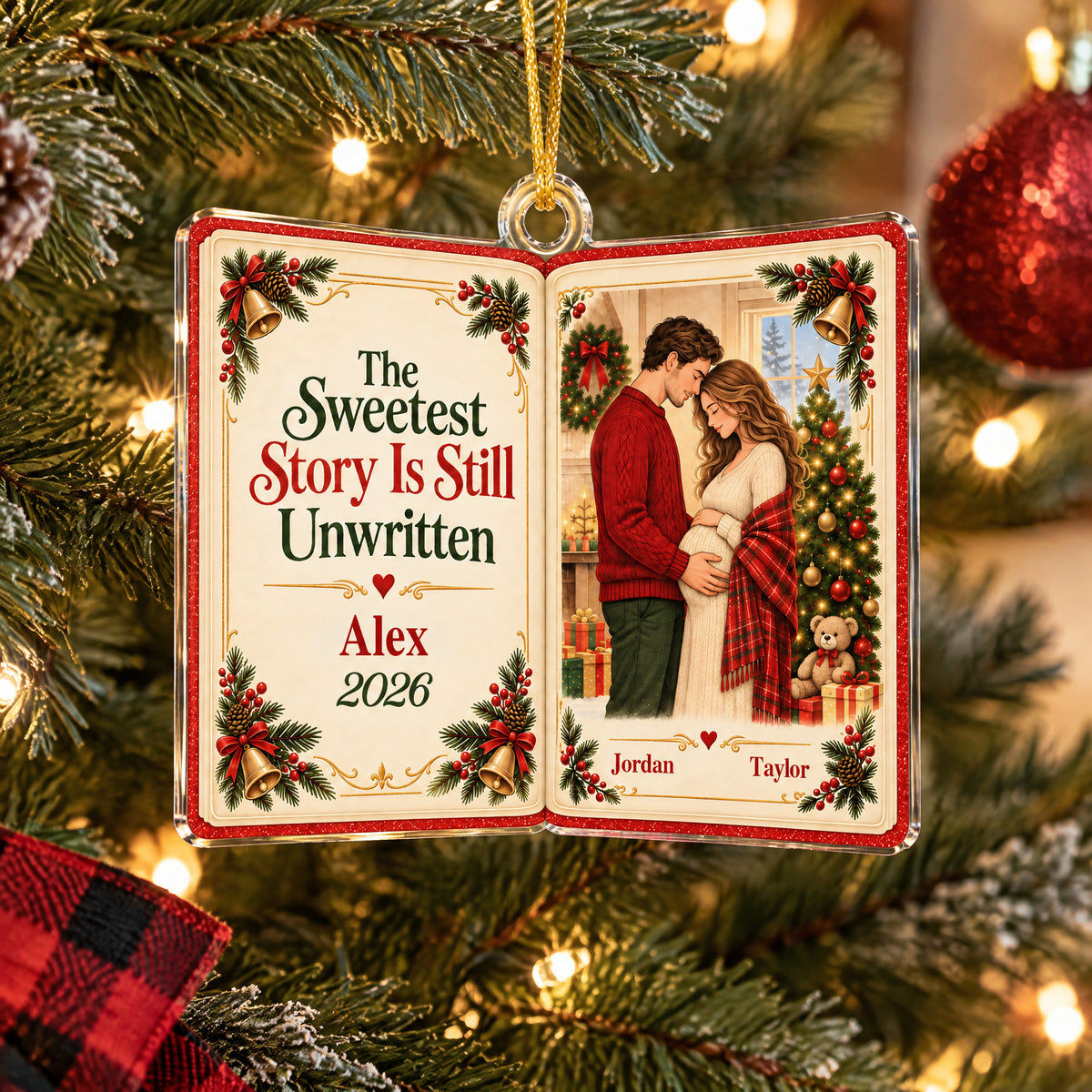 Personalized acrylic book ornament shown close up on a tree branch beside a red plaid ribbon