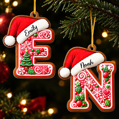 Personalized Gingerbread Initial Letter Acrylic Ornament, letters E and N with Santa hats hanging on a tree