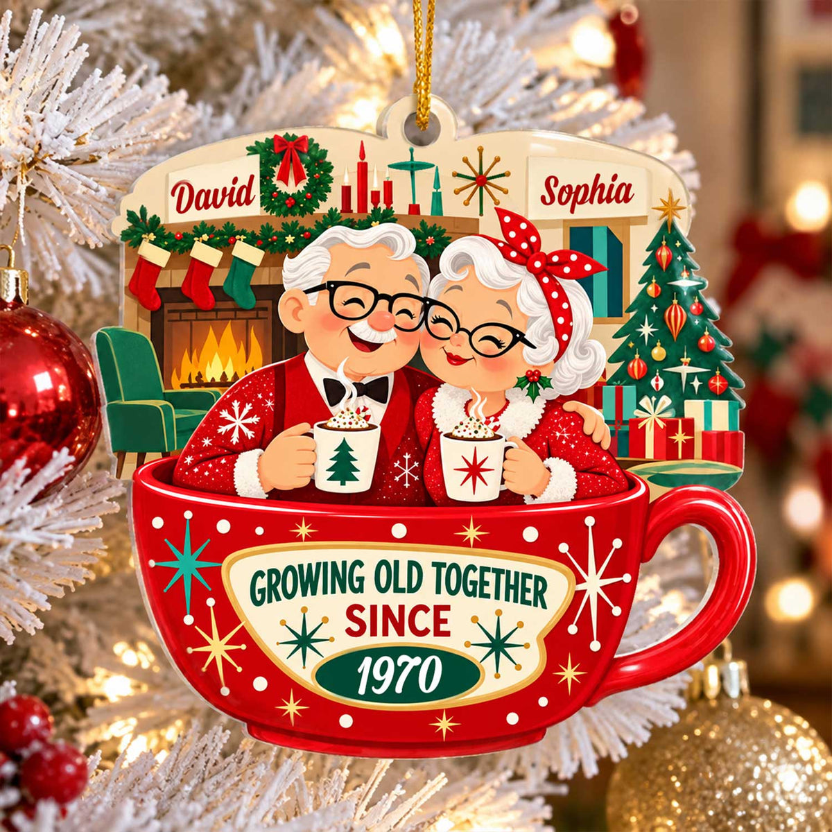 Personalized Christmas acrylic ornament with elderly couple in a red cocoa cup, hanging on a frosted tree beside red baubles