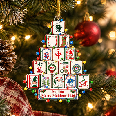 Personalized Mahjong Christmas Tree Acrylic Ornament on a tree beside a pinecone and plaid ribbon