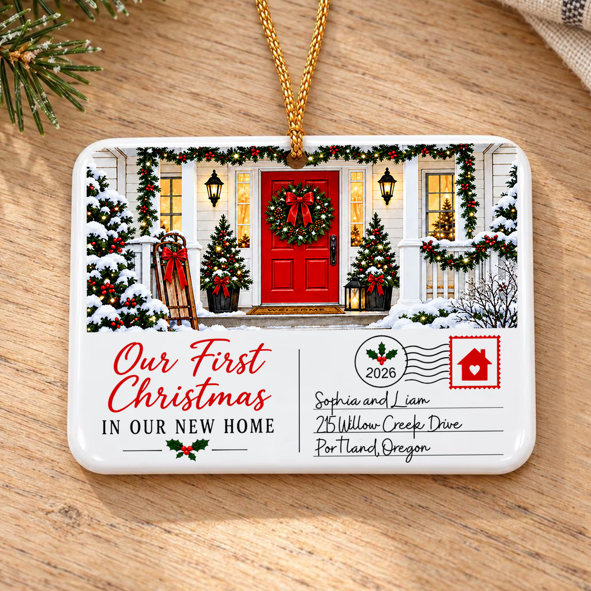 Personalized postcard rectangle ceramic ornament lying flat on a wooden surface with a pine sprig