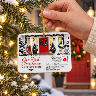 Personalized postcard rectangle ceramic ornament held by a hand on a gold cord near a snowy tree
