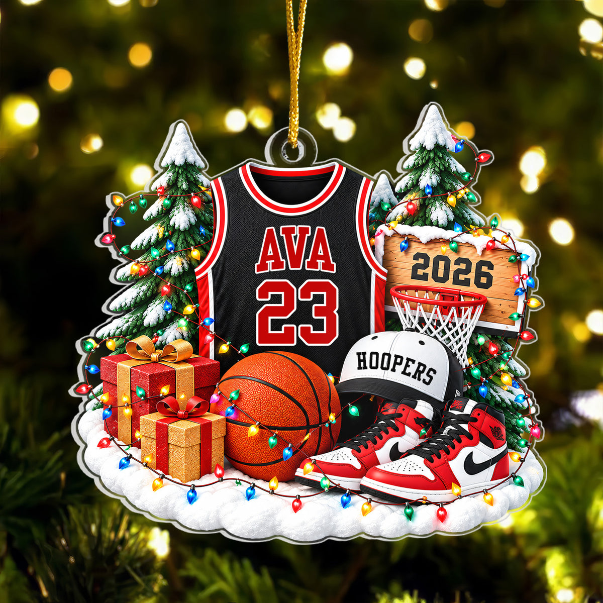 Personalized Basketball Acrylic Ornament with black jersey, ball, sneakers and gifts hanging on a lit tree