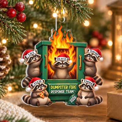 Dumpster Fire Response Team Personalized Acrylic Ornament with five raccoons hanging on a pine branch near warm lights