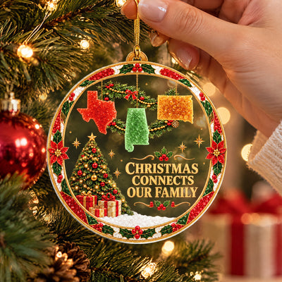 Personalized acrylic ornament custom state garland held by a hand beside a red bauble on a lit tree
