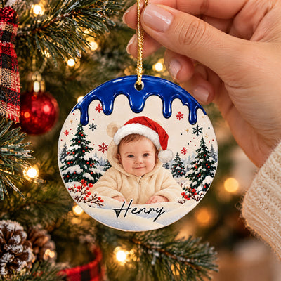 Personalized acrylic ornament custom photo with blue drip top, held by a hand near a Christmas tree