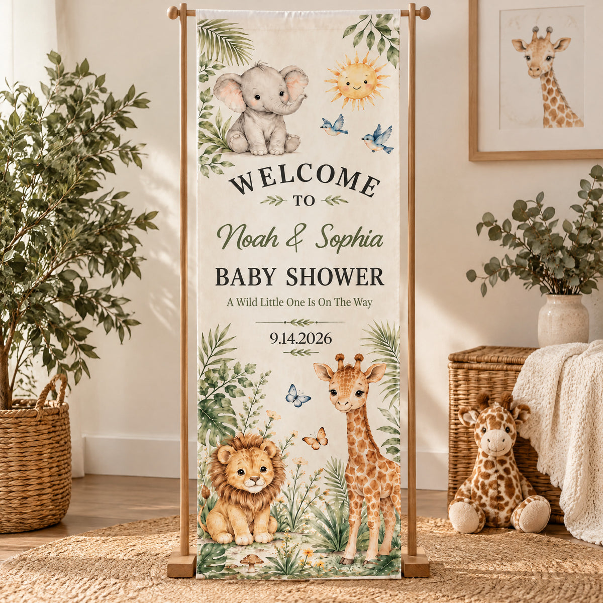 Personalized Safari Baby Shower Banner on a wooden stand beside a plant, wicker basket and plush giraffe