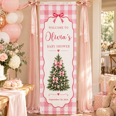 Custom Baby Shower Banner Pink Gingham hung on a draped frame beside balloons, flowers and cupcakes