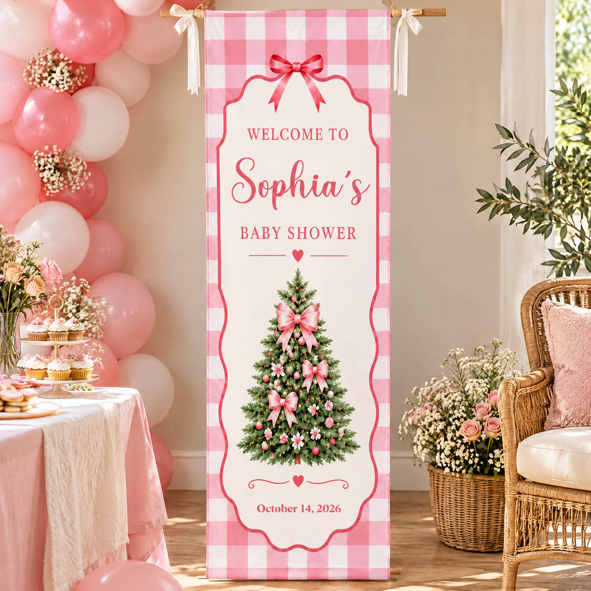 Custom Baby Shower Banner Pink Gingham with Sophia name beside a balloon garland, dessert table and wicker chair