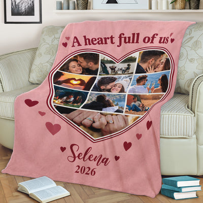 Personalized heart photo blanket draped over a cream sofa with books on the floor, name Selena and 2026