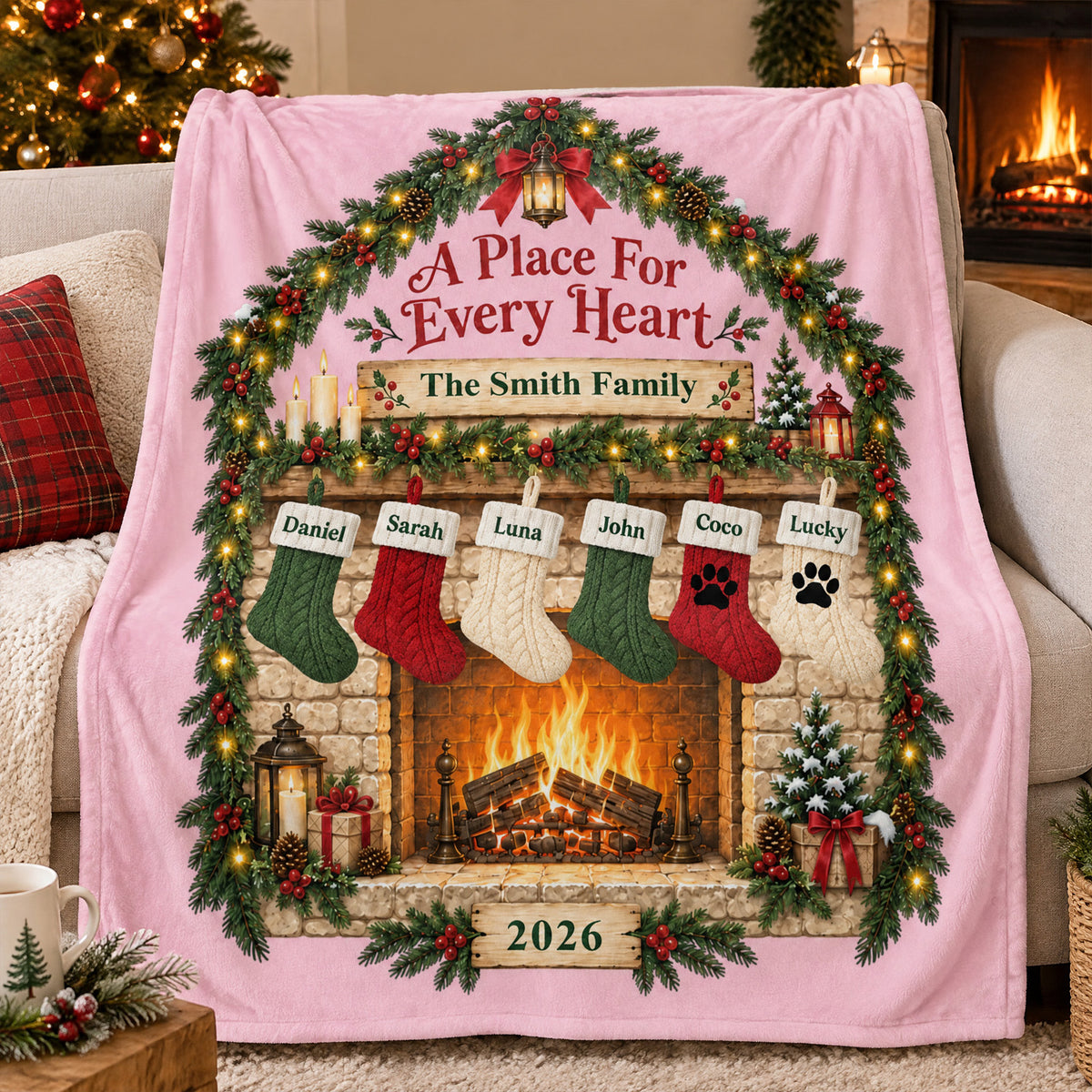 Personalized blanket custom family name in pink with six stockings, draped over a sofa by a Christmas tree