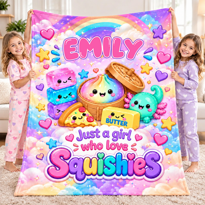 Personalized squishy blanket custom name held up by two smiling girls in pajamas in a living room