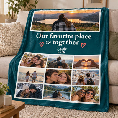 Personalized photo blanket angled over a beige sofa beside a cushion, table and plant