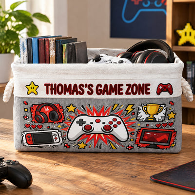 Personalized Game Zone Storage Basket in gray with red gamer artwork, books and headphones on a wooden table