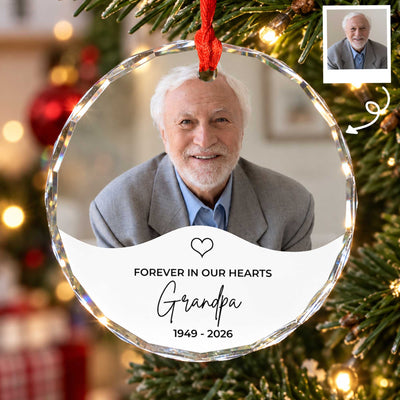 Personalized glass ornament custom photo with grandpa portrait and 1949 - 2026 hanging on a lit Christmas tree