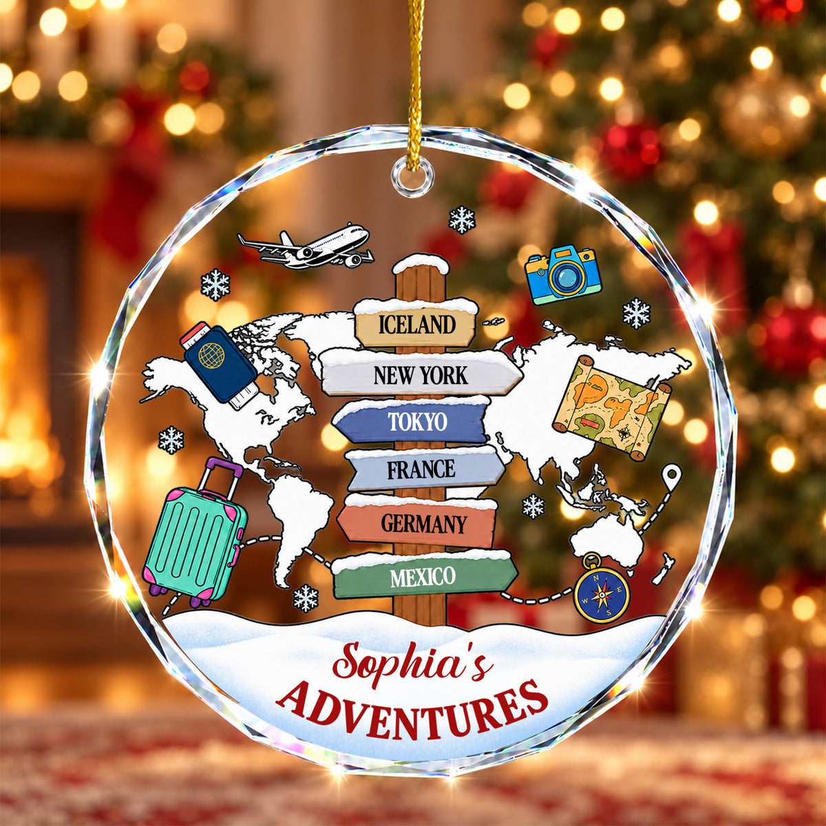 Personalized glass ornament adventure map with six destination signs, in front of a lit tree and fireplace
