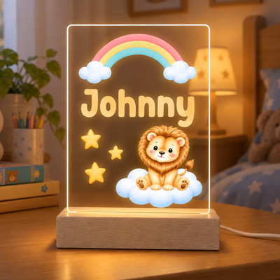 Personalized lion acrylic night light with name Johnny on a wooden base beside books and a pencil cup