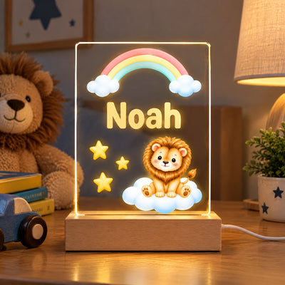 Personalized lion acrylic night light with name Noah next to a plush lion toy, toy car and small plant