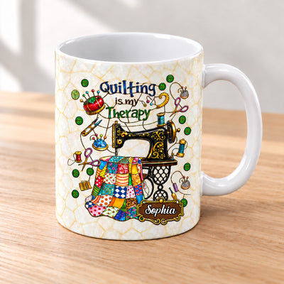 Quilting Is My Therapy Personalized Mug on a wooden table beside stacked floral fabrics and thread spools
