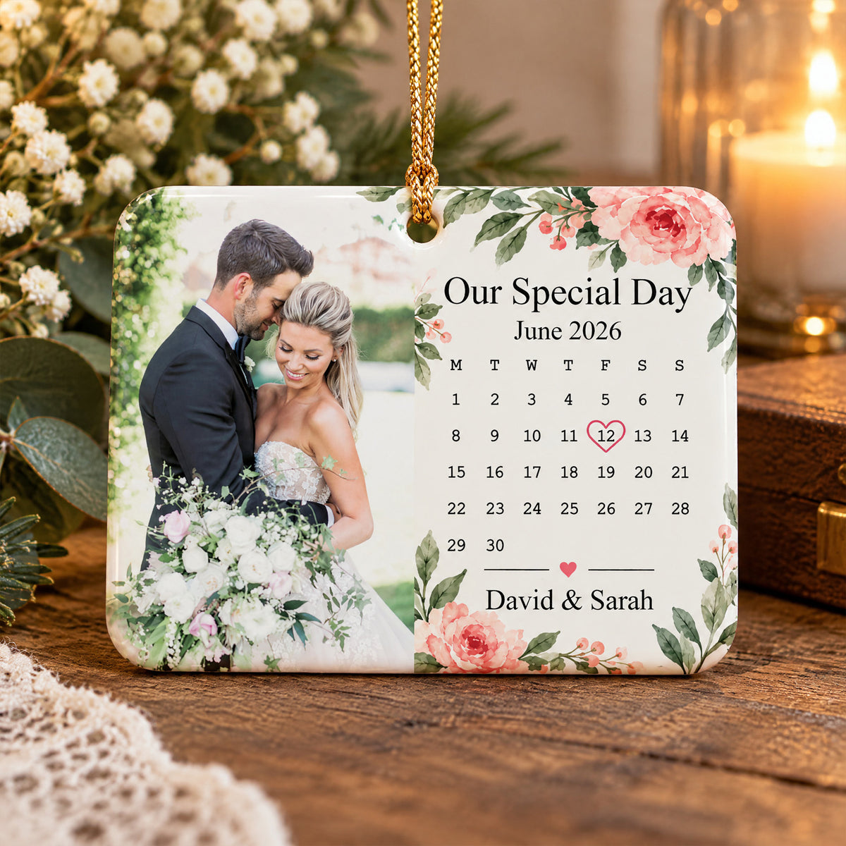 Personalized rectangular ceramic ornament on a wooden table beside white flowers and a candle