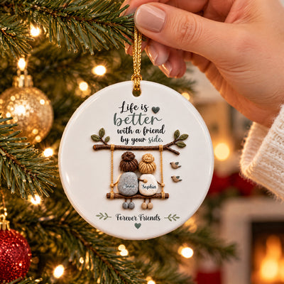 Personalized Ceramic Ornament Friendship Keepsake held by hand near a tree with gold and red baubles