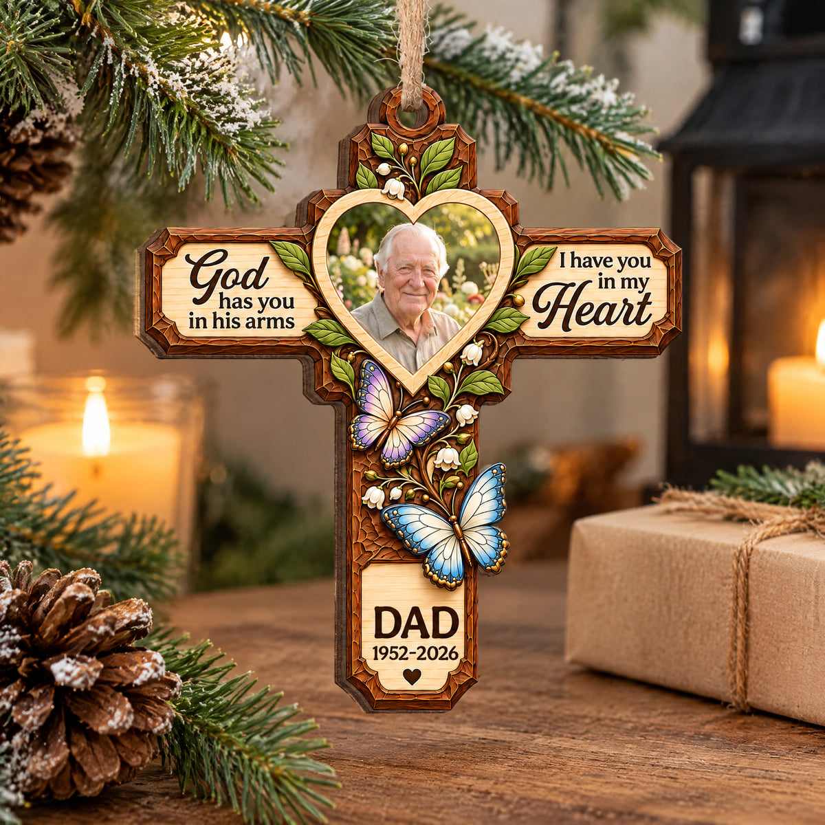 Personalized Memorial Wooden Ornament on a wooden table beside a candle, pinecone and wrapped gift