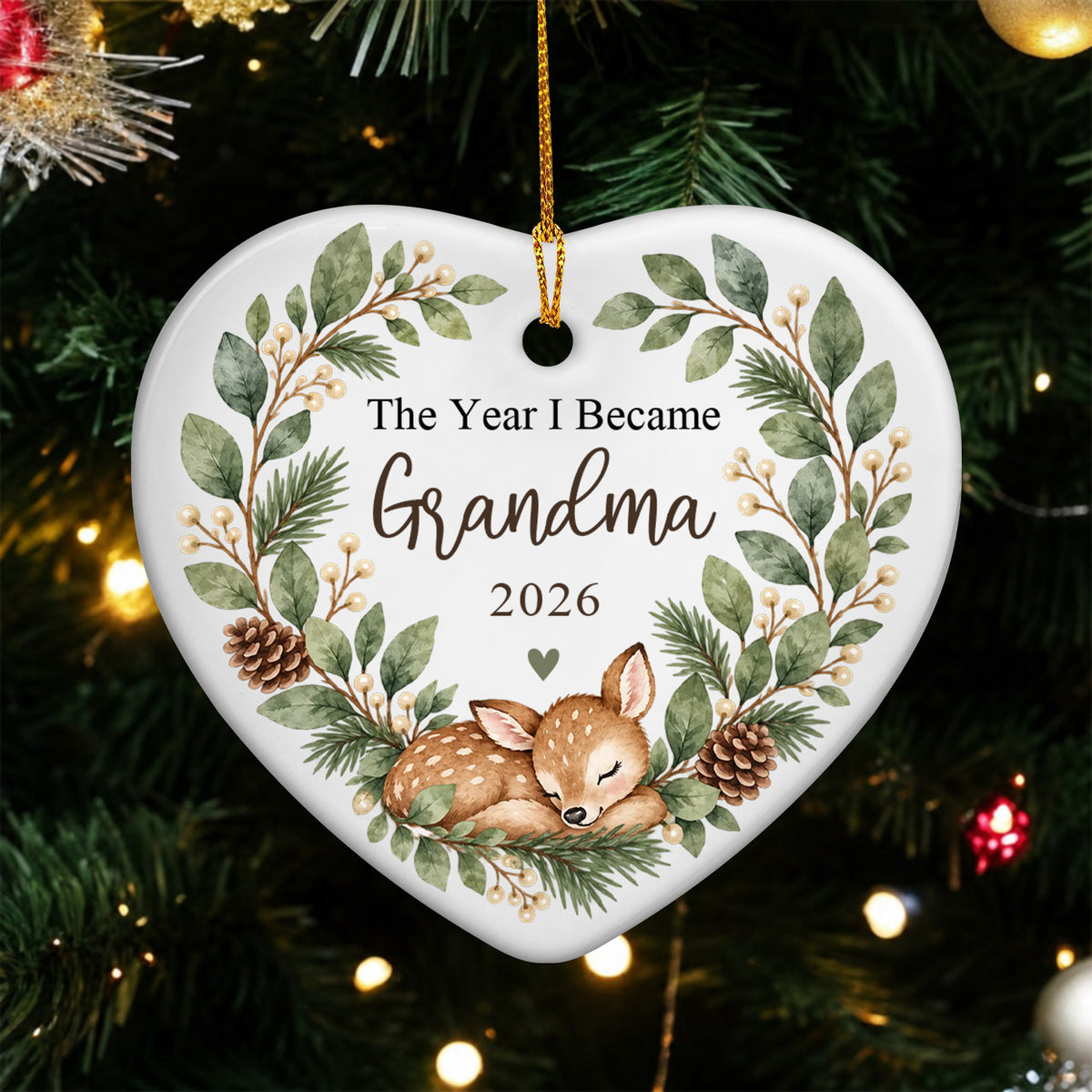 Personalized Ceramic Ornament Grandma Box heart hanging on a green Christmas tree with warm lights