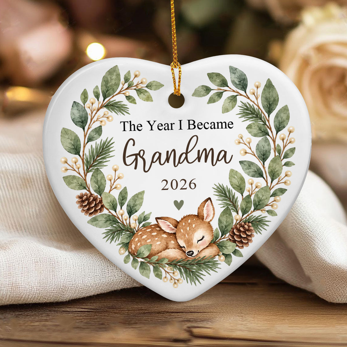 Personalized Ceramic Ornament Grandma Box heart resting on a cream knit cloth and wooden table
